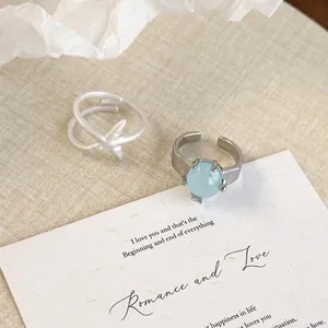 Adjustable silver starfish ring and light blue gemstone ring for summer beach vacations