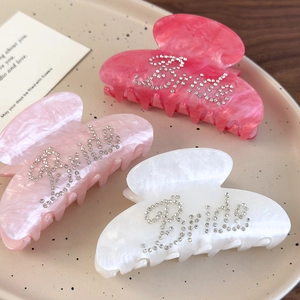Three-piece set of rhinestone Bride hair claws in pink and white marble finish