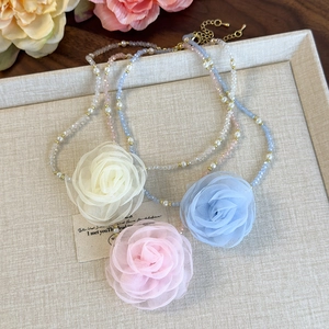 Elegant beaded rose choker necklaces in beige, pink, and blue with faux pearls