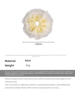 Detail view of lace scrunchie with dimensions 20cm diameter and fabric material info