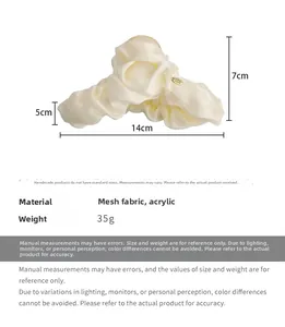 Detail view of cream mesh hair claw clip with 14cm length and 7cm height dimensions