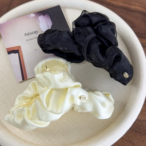 Elegant double-layered mesh hair claw clips in black and beige with gold metal label