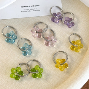 Colorful floral hoop earrings set featuring five pastel translucent flower charms in a tray