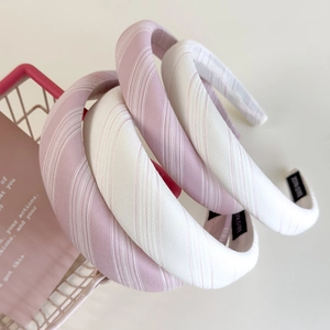 Pink striped fabric sponge headbands in purple and beige styles for a vintage look