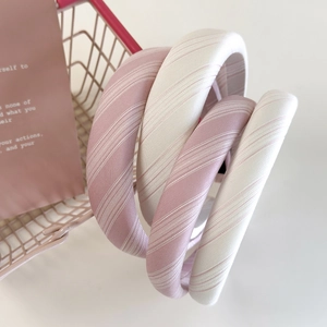 Set of 4 stylish padded striped fabric headbands in pink and white colors for women