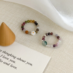 Daisy colorful beaded rings set with green jade-like stone and floral charms