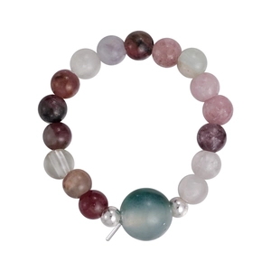Close-up of a colorful natural stone beaded bracelet with a large teal focal bead