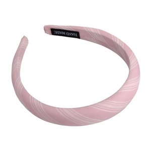 Light pink striped fabric sponge headband for women with a handmade label