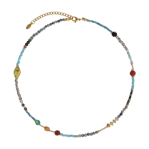Detail of colorful beads and natural stone necklace with gold lobster clasp and chain