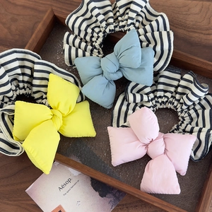 Set of three oversized bow scrunchies in yellow, blue and pink with striped edges