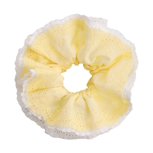 Mint green lace scrunchie with delicate embroidery for a sweet and versatile ponytail look