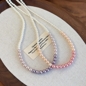 Elegant gradient pink and purple pearl choker necklace for women with a luxury aesthetic