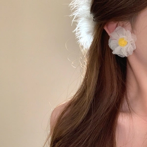 Exaggerated white organza flower earrings with yellow stamen for a vacation atmosphere