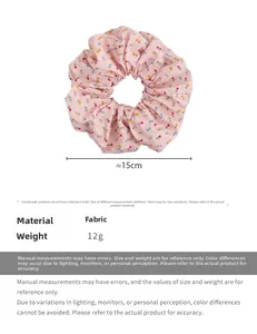 Detailed size view of pink floral fabric scrunchie with 15cm diameter measurements