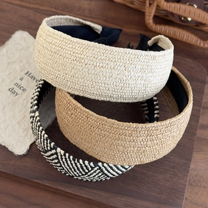 Three wide straw woven headbands in cream, light brown and chevron patterns for women