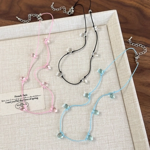 Minimalist cord choker set with transparent water drop beads in pink, black, and light blue