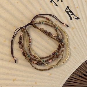 Multi-layer vintage beaded bracelet set in earthy Maillard tones with adjustable cord
