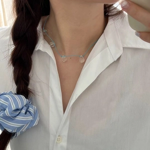 Minimalist summer cord necklace with clear water-drop pendants on blue string