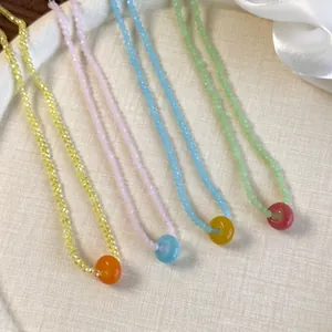 Colorful acrylic crystal beaded necklace with donut pendant in four vibrant summer colors