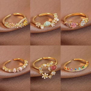 Adjustable gold rings set featuring colorful enamel butterfly, heart, and shell charms