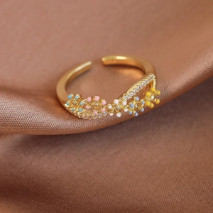 Macro detail of French floral ring featuring colorful enamel flowers and sparkling zircons