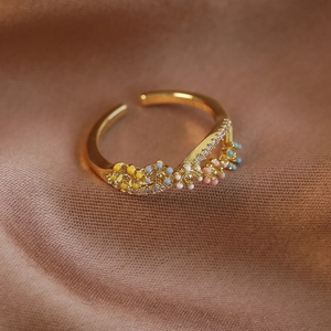 Macro detail of French colorful floral open ring with enamel flowers and micro zircons