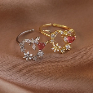Adjustable floral wreath ring with white enamel, zircon, and red heart gemstone decoration