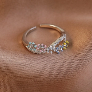 Detail view of the adjustable silver floral ring with colorful enamel beads and zircons