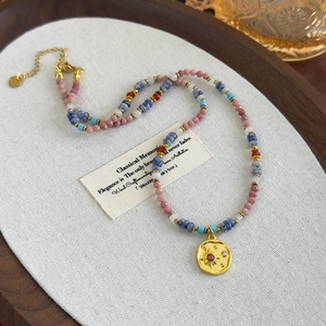 Pink and blue beaded sun pendant necklace for women with gold tone accents