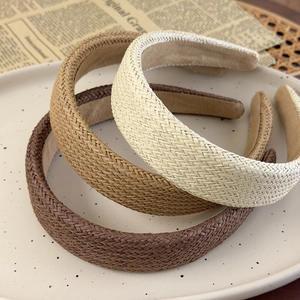 Three woven straw wide headbands in brown, khaki and beige for a vintage summer look