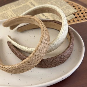 Three minimalist woven straw wide headbands in cream, light brown and coffee brown colors