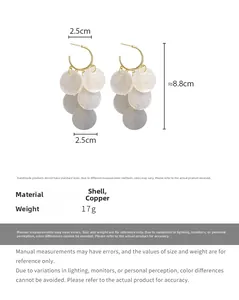 Detail view of shell tassel earrings showing 8.8cm length and 2.5cm width dimensions