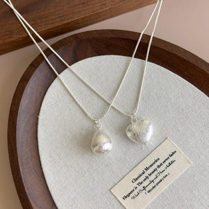 Minimalist silver brushed heart and teardrop necklaces with elegant thin snake chains