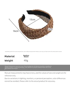 Close-up of brown hand-woven straw headband with size measurements and smooth black lining