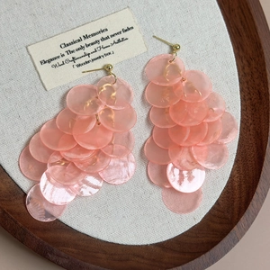 Elegant mint green shell tassel earrings with layered pink shell discs and gold plating