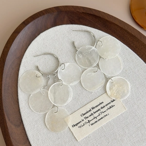 Island style long tassel shell earrings with silver hoops and layered white discs