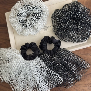 Elegant black and white sequin hair scrunchies with lace ribbons and mesh texture