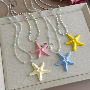 Summer ocean style beaded starfish necklaces in pink, yellow, blue and cream white colors