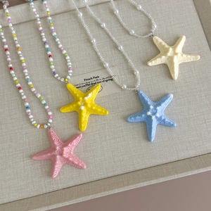 Long beaded starfish necklaces in vibrant summer colors for tropical beach vacations