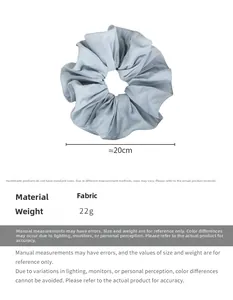 Detail of light blue fabric scrunchie showing 20cm diameter and lightweight texture