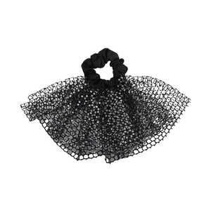 Close-up of black mesh scrunchie with silver sequins and oversized bow detail