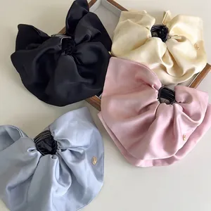 Elegant satin bow hair claw clips in black, beige, pink and blue colors for women