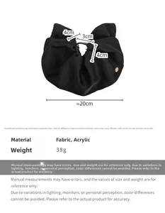 Detail showing the 20cm oversized black satin fabric bow hair claw clip with 38g weight