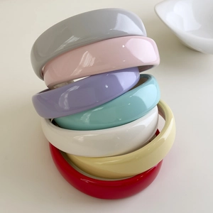Detail of colorful glossy patent leather headbands with thick padded sponge design