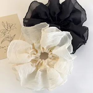 Oversized pleated chiffon scrunchies in cream and black for elegant ponytails