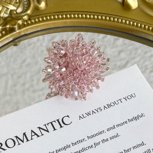 Macro shot of romantic pink beaded floral shoe charm with crystal texture for DIY clogs
