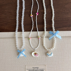 Colliers en coquillage et perles bleues pour femmes de style vacances à la plage
