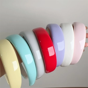Collection of vibrant candy-colored glossy patent leather padded headbands for women