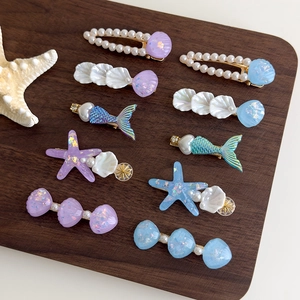 Barrettes sirène avec coquillage et étoile de mer en résine pailletée et perles