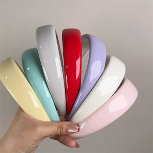 Close-up of colorful patent leather padded headbands with anti-slip matte inner lining